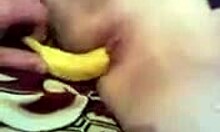 Boyfriend puts a banana in ex-girlfriend's pussy